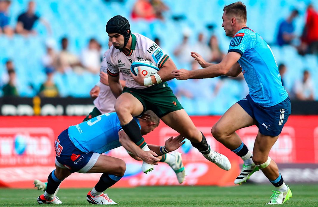 A Connacht player avoiding a tackle in rugby