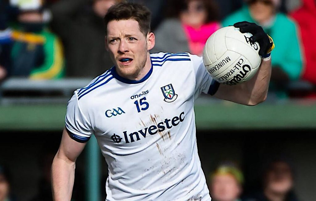 Conor McManus during a game about to bounce the ball