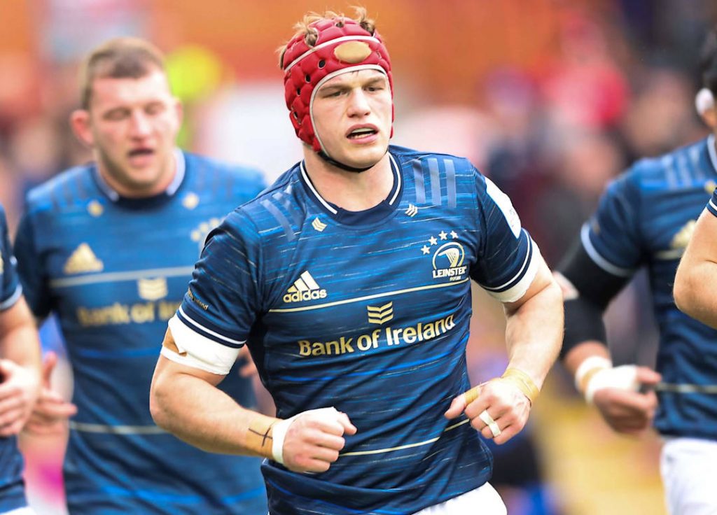 A photo of Leinster rugby players warming up for a game