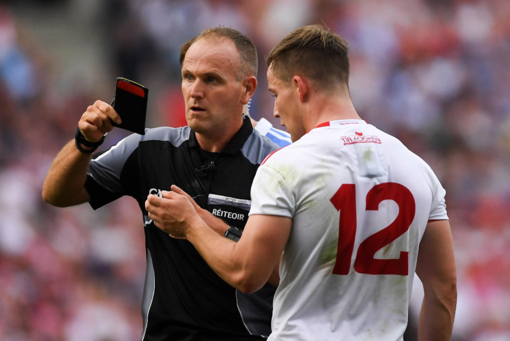 Referee handing out a black card GAA