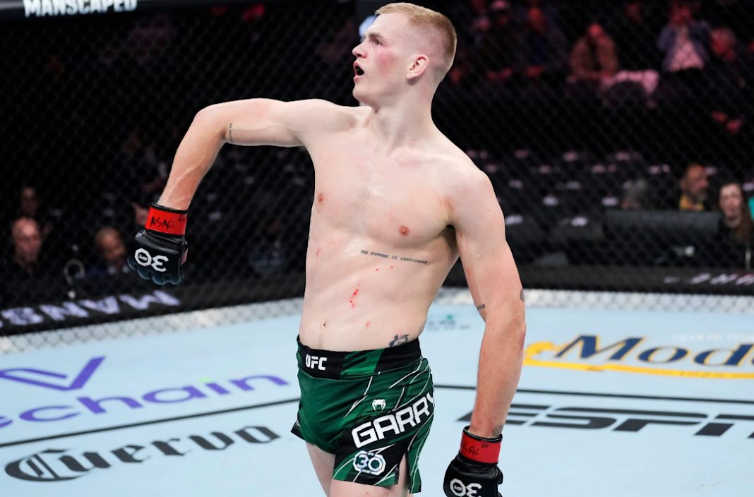 Ian Garry celebrating after a fight