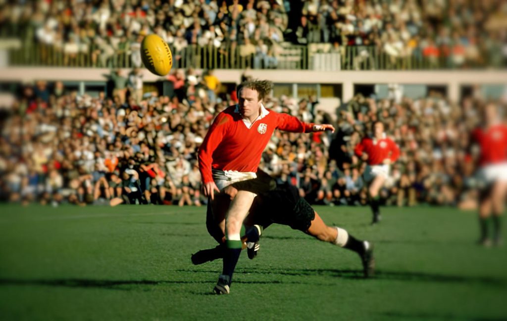 Photo of Mike Gibson kicking a ball