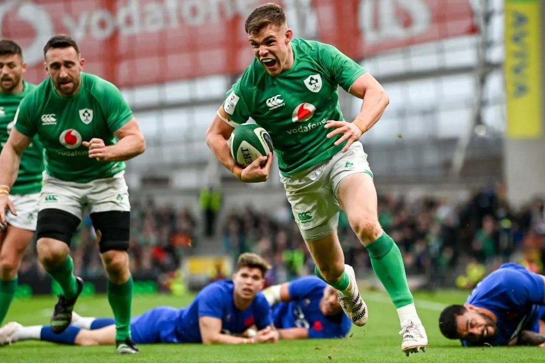 Ireland Rugby player running in a try against France
