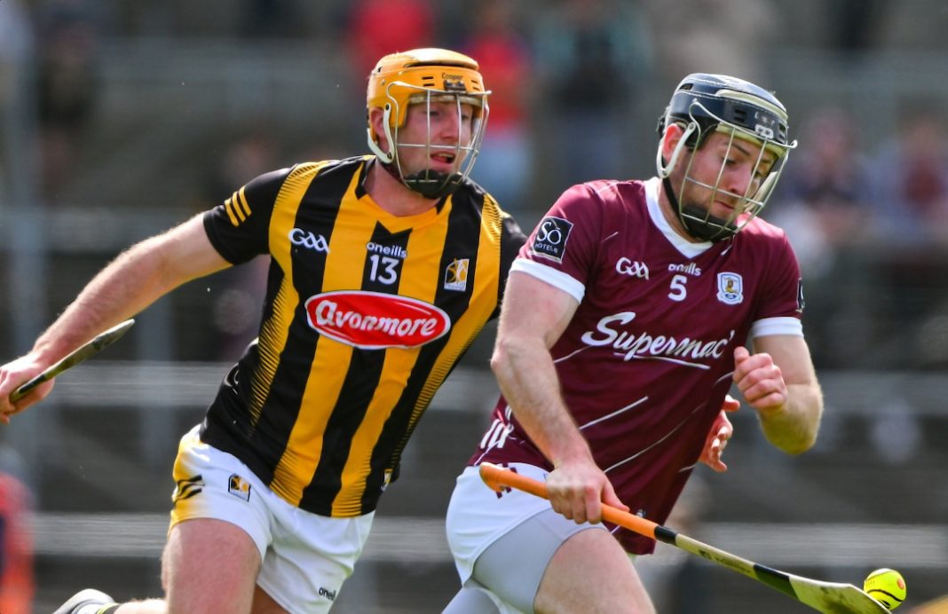 Kilkenny hurling player chasing down the opposition