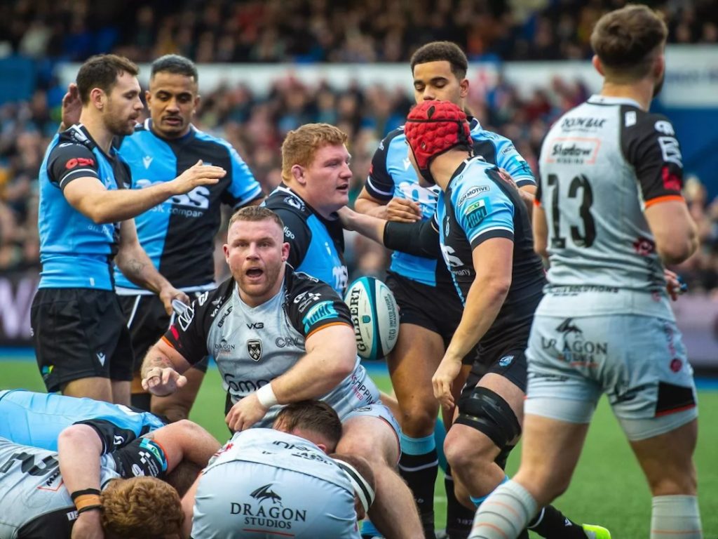 Cardiff rugby players reacting to a try
