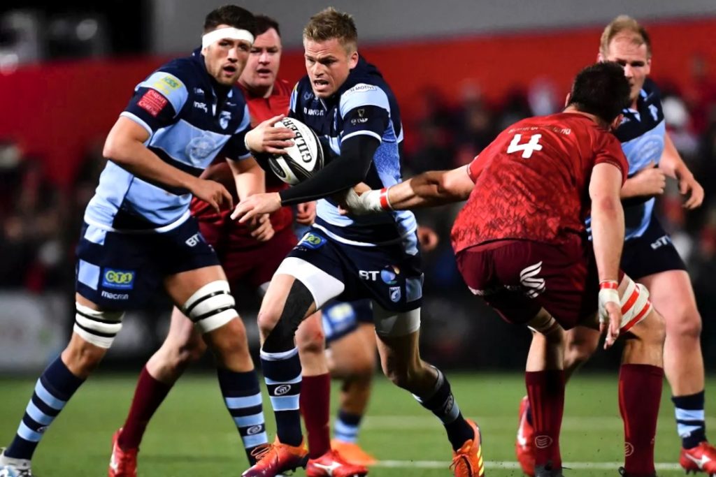 CArdiff Rugby player trying to avoid a tackle