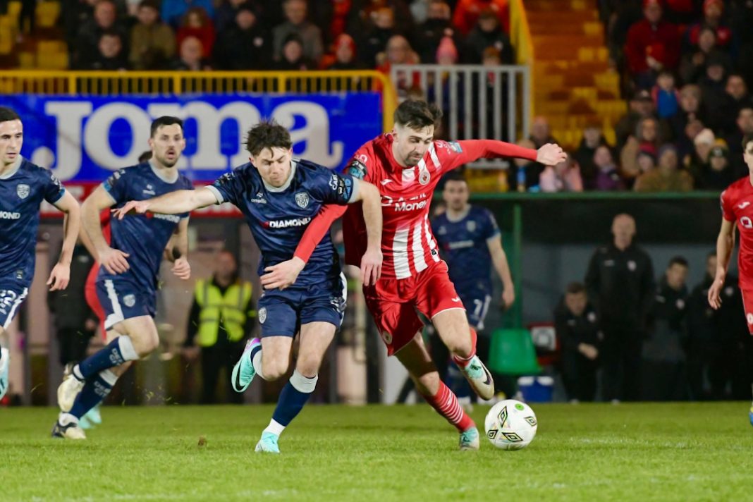Derry City FC player trying to win the ball back