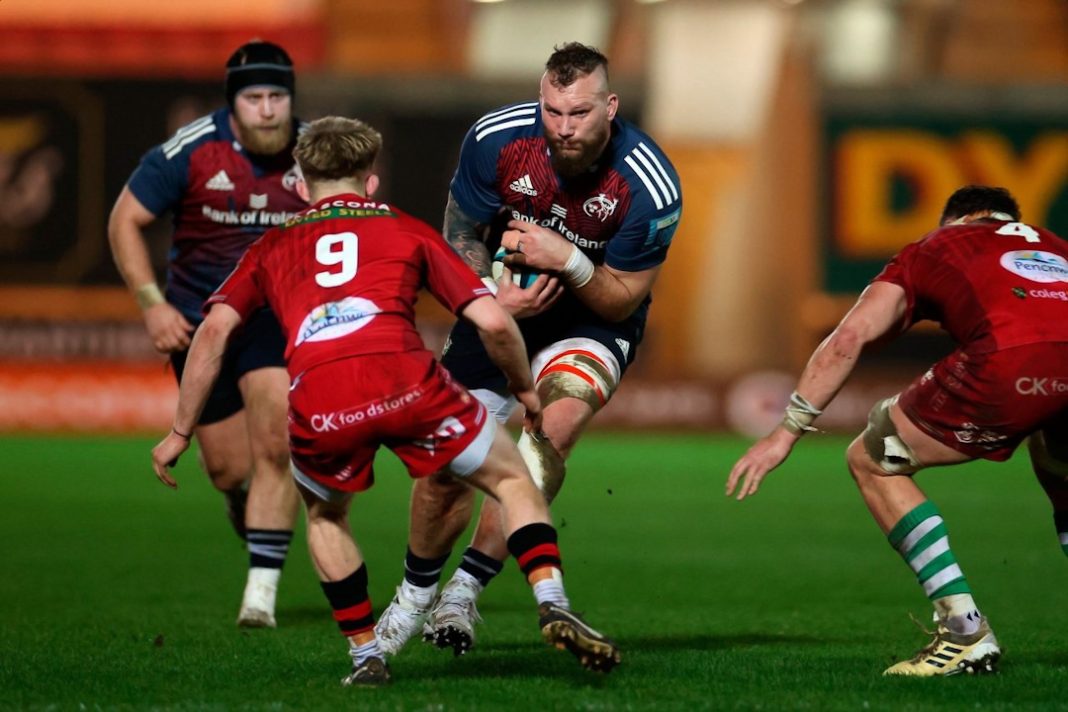 Munster Rugby player bracing for a tackle
