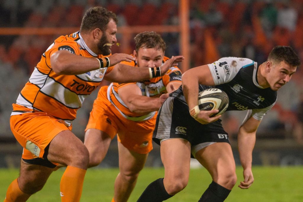 Ospreys player avoiding a tackle