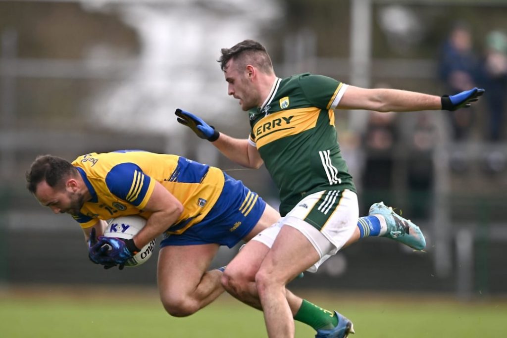 Roscommon GAA player falling next to a Kerry player
