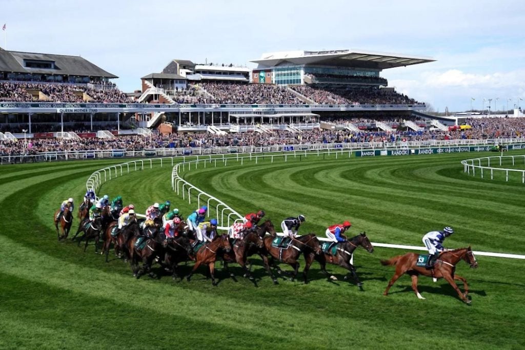 A photo of the Grand National horses rounding the final bend