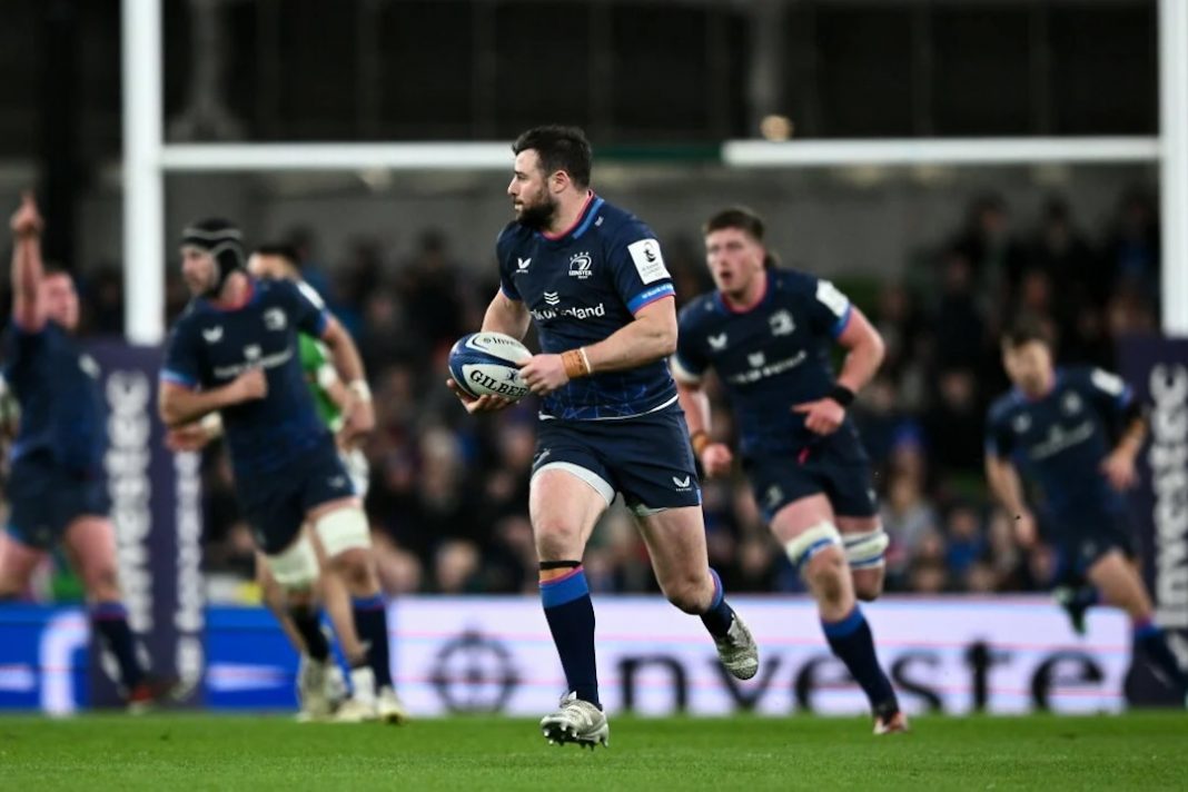 Leinster rugby player running with the ball toward the try line