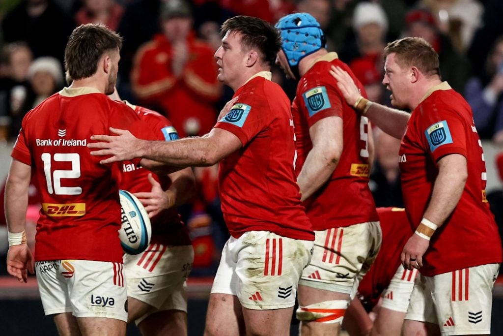 Munster rugby players celebrating a try scored