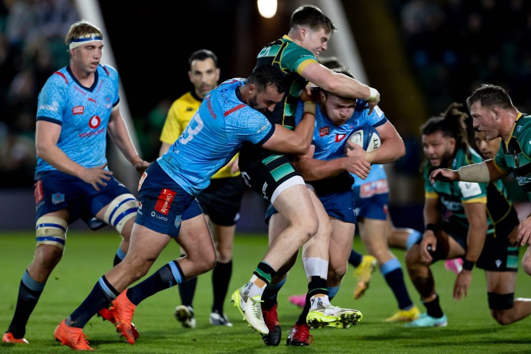Bulls players tackling a rugby player