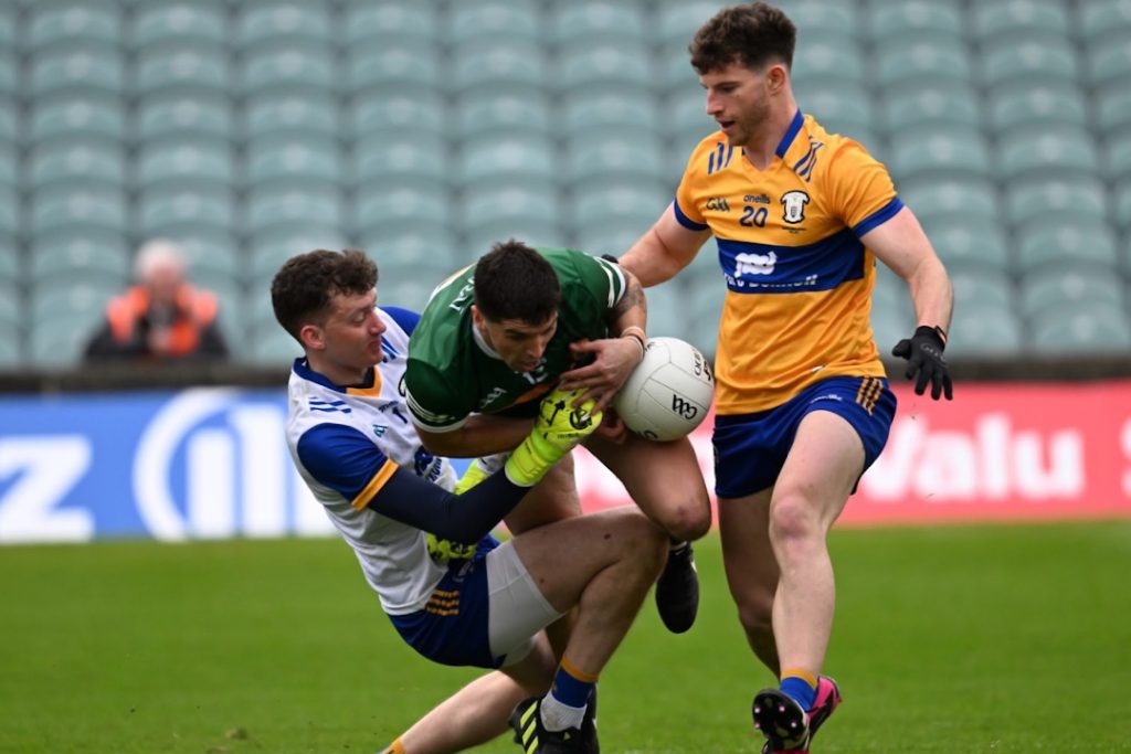 Clare GAA player tackling Kerry attacker