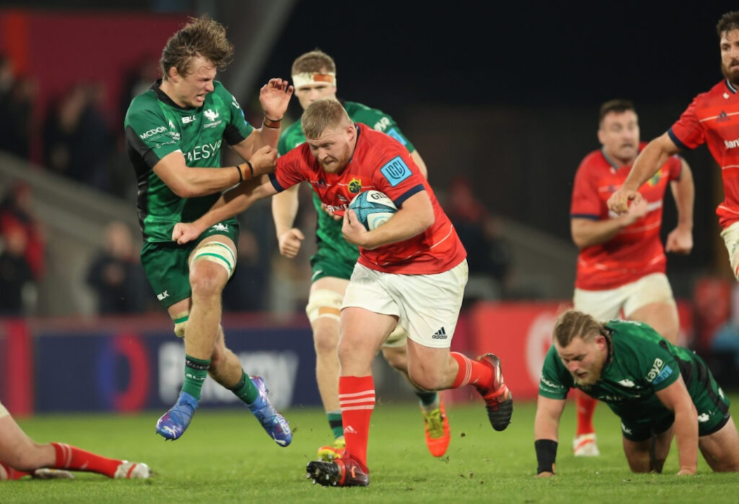 Munster Rugby player running with the ball against Connacht