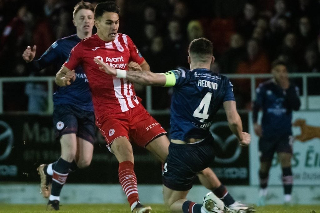 St Patrick's Athletic player slide tackling