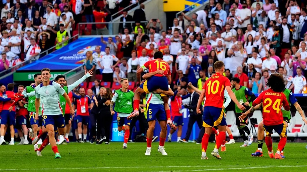 Spain players celebrating after defeating Germany