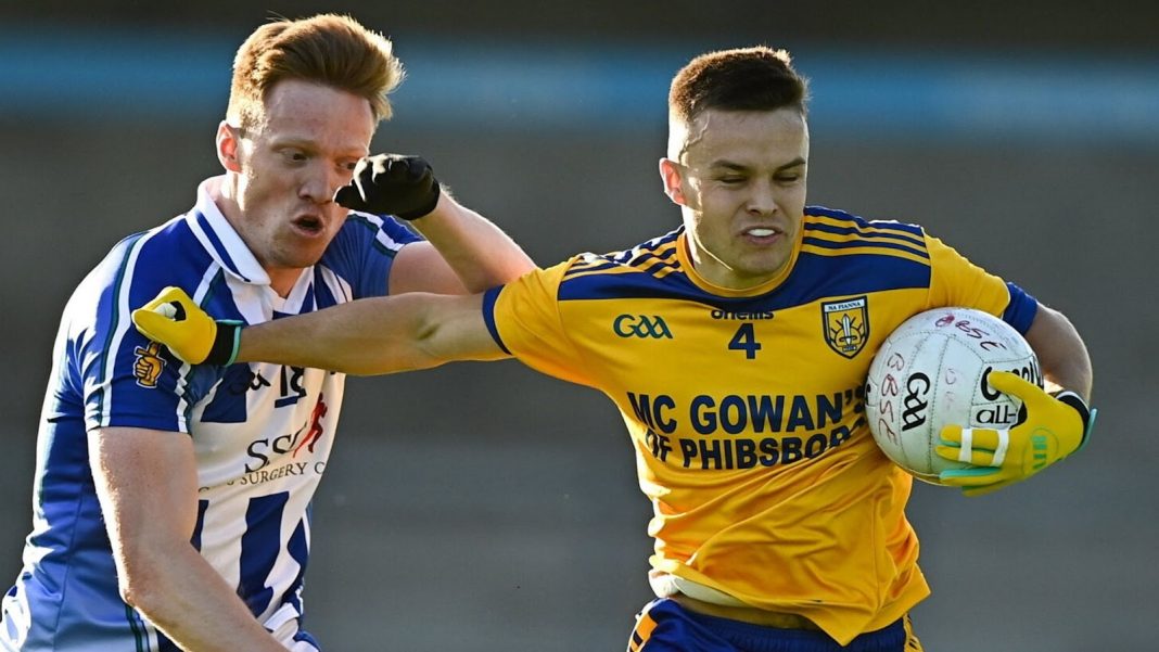 Na Fianna player shrugging off the opposition