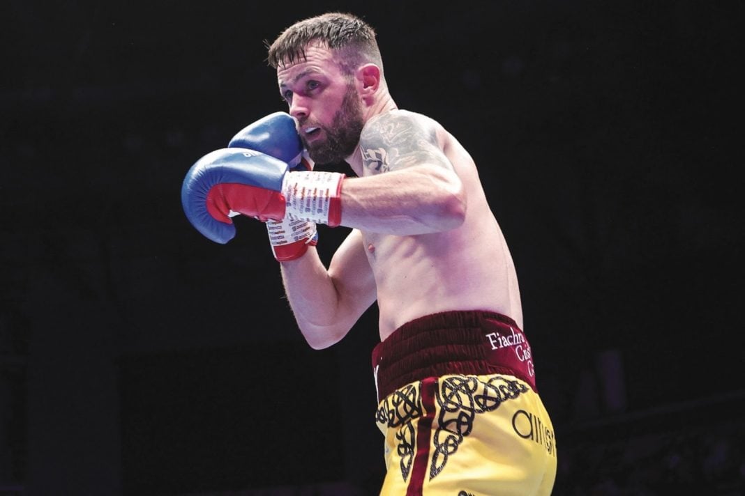 Padraig McCrory in the boxing ring lining up a punch