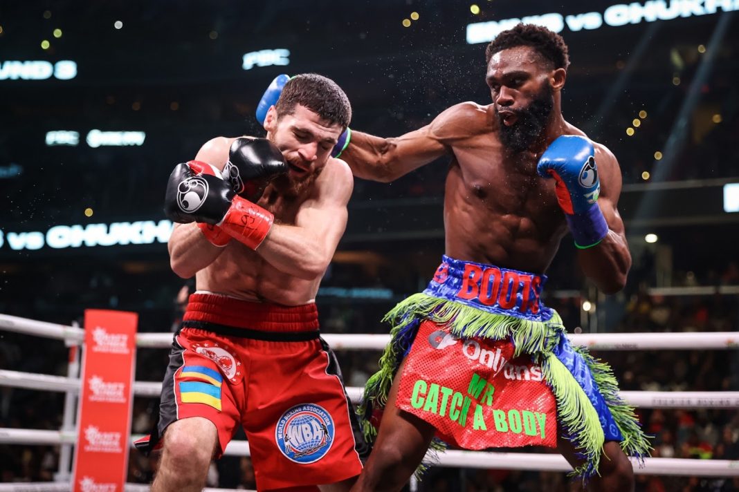 Jaron Ennis punches Karen Chukhadzhian in the boxing ring