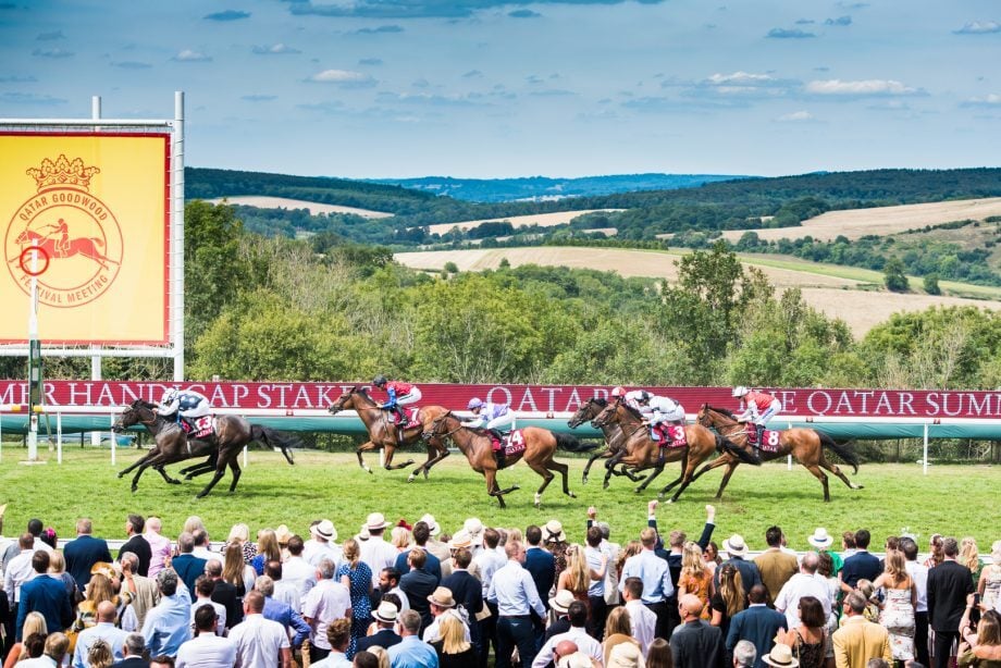 A race taking place at the Goodwood Racecourse during the summer