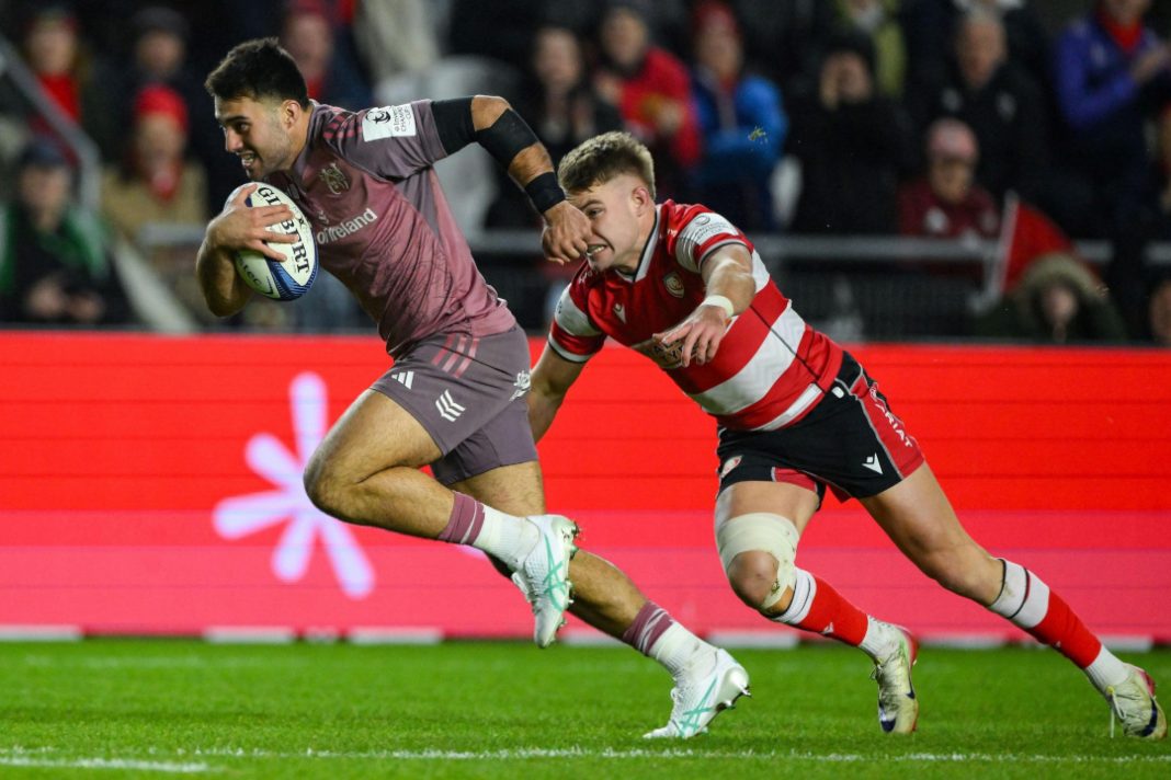 Munster rugby players running with the ball