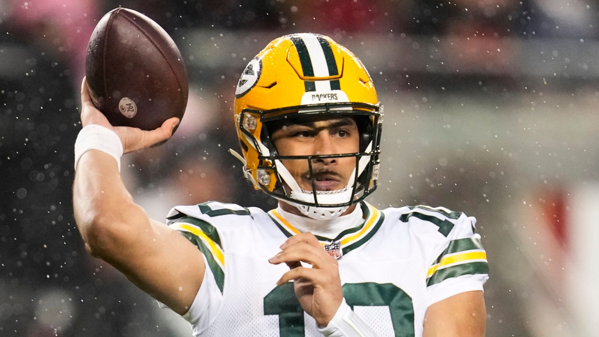 One of the highest-paid NFL players, Jordan Love, making a pass