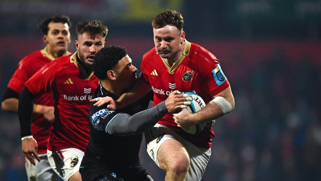 Munster rugby player riding a tackle